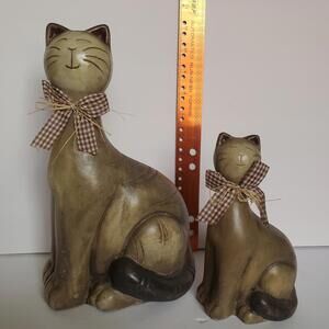 Cat Figurines X2 Folk Art Whimsical Glazed Clay Hand Painted Sitting Checked Bow
